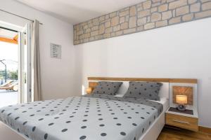 Postel nebo postele na pokoji v ubytování Villa Bajadera