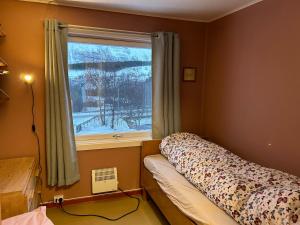 Ένα ή περισσότερα κρεβάτια σε δωμάτιο στο House at Elvevoll