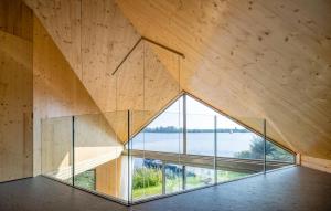 a room with a large window and a wooden wall at 3 Bedroom Lovely Home In Warten in Warten