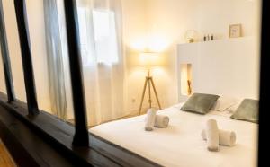 a bedroom with a bed with two stuffed animals on it at Casamea - Suite U Sognu in Talasani