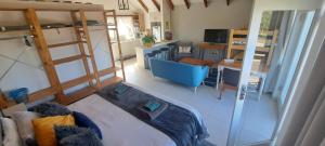 an aerial view of a living room with a bunk bed at Cape Dutch Flair in Durbanville +7 photos