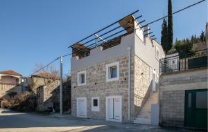 a building with stairs on the side of it at 3 Bedroom Awesome Home In Mliniste in Mlinište