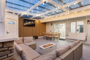 a living room with a couch and a table at Steps to the Beach 2 Units w Patio Fire Pit Pacific Coast Highway Buyout in Huntington Beach