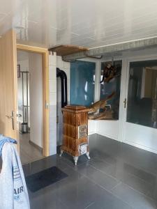 a room with a wood stove in a room at Petit Studio du Horst Bach in Wimmenau +6 photos