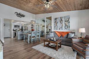 a living room with a couch and a table at Lakeview Getaway in Kimberling City
