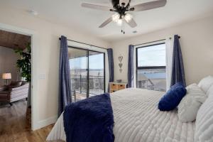 a bedroom with a bed and a large window at Lakeview Getaway in Kimberling City +66 photos