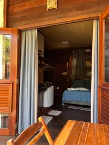 Cama ou camas em um quarto em Chalés Paradise