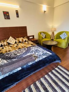 a bedroom with a bed and a couch at Dun Haven Height in Dehradun