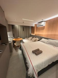 Postel nebo postele na pokoji v ubytování Studio novíssimo - Alive melhor localização