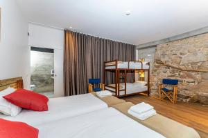 Postel nebo postele na pokoji v ubytování Olá Vida - Hostel Caminha