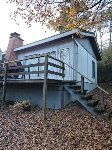 a tiny house with a staircase leading to it at Wali's Nature Bliss Dinant Givet in Waulsort