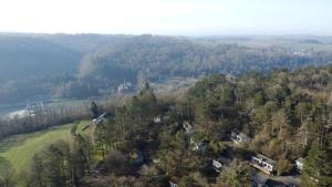 an aerial view of a house on a hill with trees at Wali's Nature Bliss Dinant Givet in Waulsort