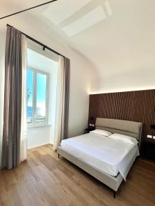 Postel nebo postele na pokoji v ubytování Bianca Guesthouse
