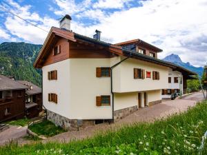 a house in the mountains with mountains in the background at Holiday Home Punta Emma by Interhome in Pera +35 photos