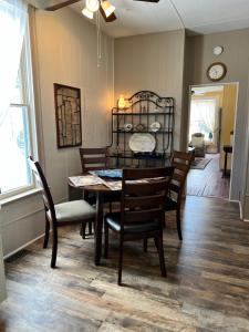 a dining room with a table and chairs at Historic 1895 Home in Cripple Creek