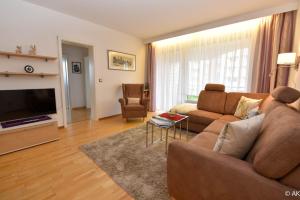 TV a/nebo společenská místnost v ubytování Haus "Strandnixe" Appartement ST107