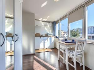 a kitchen and dining room with a table and chairs at Studio Nina by Interhome in Umag +23 photos