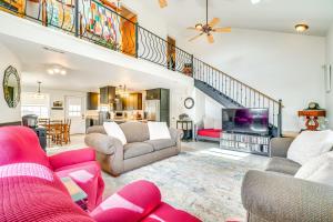 a living room with two couches and a tv at 8 Mi to Tellico Plains House and Cabin Near Trails! in Tellico Plains