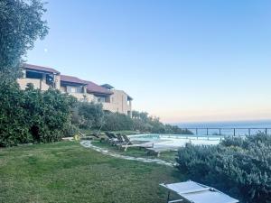 a view of a swimming pool and the ocean at Apartment I Castellari by Interhome in Ranzi