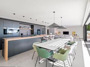 an open kitchen and dining room with a table and chairs at Villa Cabo de Gata by Interhome in Moraira