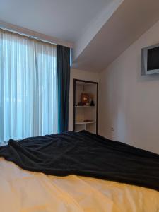 Ένα ή περισσότερα κρεβάτια σε δωμάτιο στο Palm Guesthouse