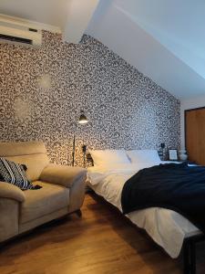 Ένα ή περισσότερα κρεβάτια σε δωμάτιο στο Palm Guesthouse