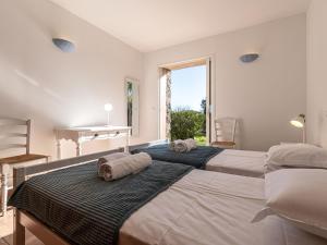 Posteľ alebo postele v izbe v ubytovaní Villa Villa Capicciola by Interhome