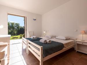 Posteľ alebo postele v izbe v ubytovaní Villa Villa Capicciola by Interhome