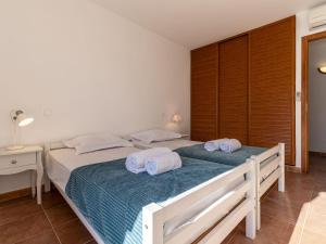 Posteľ alebo postele v izbe v ubytovaní Villa Villa Capicciola by Interhome