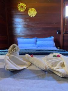 Cama ou camas em um quarto em Chalés Paradise