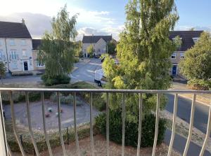 a view of a street from a balcony at Modern Penthouse in Wellingborough