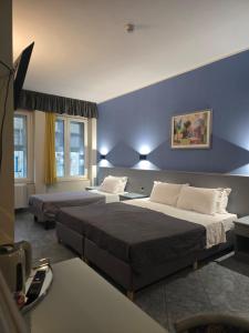 Ένα ή περισσότερα κρεβάτια σε δωμάτιο στο Hotel Vitruvio +37 φωτογραφίες
