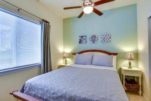 a bedroom with a bed and a ceiling fan at Padre Island Condo with Pool Access - Walk to Beach! in Corpus Christi +40 photos