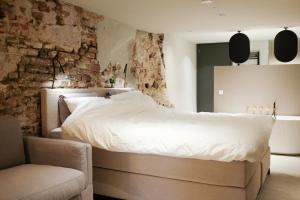 Ένα ή περισσότερα κρεβάτια σε δωμάτιο στο Domnacht aan de gracht