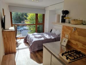 Ένα ή περισσότερα κρεβάτια σε δωμάτιο στο Alamos del Rio - Andarlibre