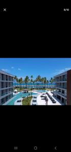 a view of a resort with a pool and palm trees at GAV Porto Alto Resorts in Ipojuca