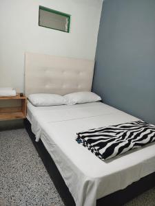 Letto o letti in una camera di Hotel Casa Verde Guatapé