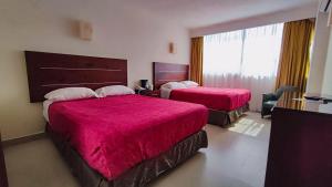 Voodi või voodid majutusasutuse May Palace Hotel  toas