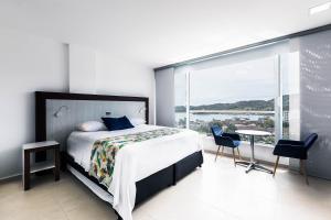 Postel nebo postele na pokoji v ubytování Hotel Santorini + 37 fotografií