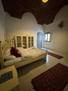 a bedroom with a large bed in a room at Sahara palace in Luxor +9 photos