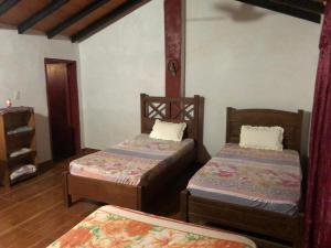 Postel nebo postele na pokoji v ubytování Rancho Ña Ignacia Nueva Colombia