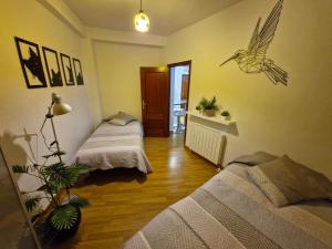 A bed or beds in a room at Apartamento Centro de Toledo