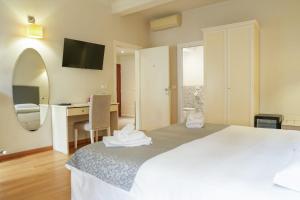 Postel nebo postele na pokoji v ubytování Honey Rooms Ferrara