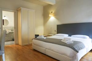 Postel nebo postele na pokoji v ubytování Honey Rooms Ferrara