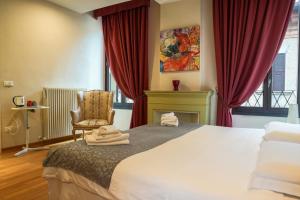 Postel nebo postele na pokoji v ubytování Honey Rooms Ferrara