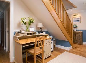 a home office with a desk with a piano at Blythedale House in Fort William