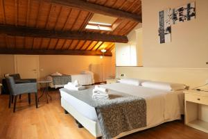 Postel nebo postele na pokoji v ubytování Honey Rooms Ferrara
