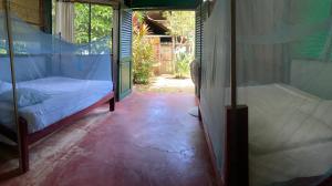 Voodi või voodid majutusasutuse Hostal El Chileno Sapzurro toas
