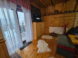 a living room with a dog laying on the floor at Villa Adanis in Bihać