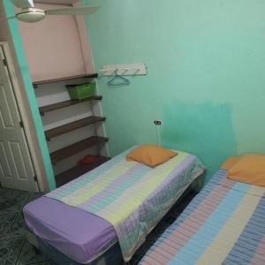 Giường trong phòng chung tại Hospedaje doña Gladys